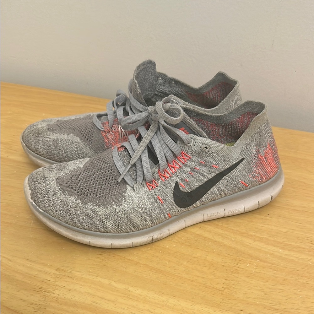 Fly knit Nike Gray and Coral Athletic Sneakers